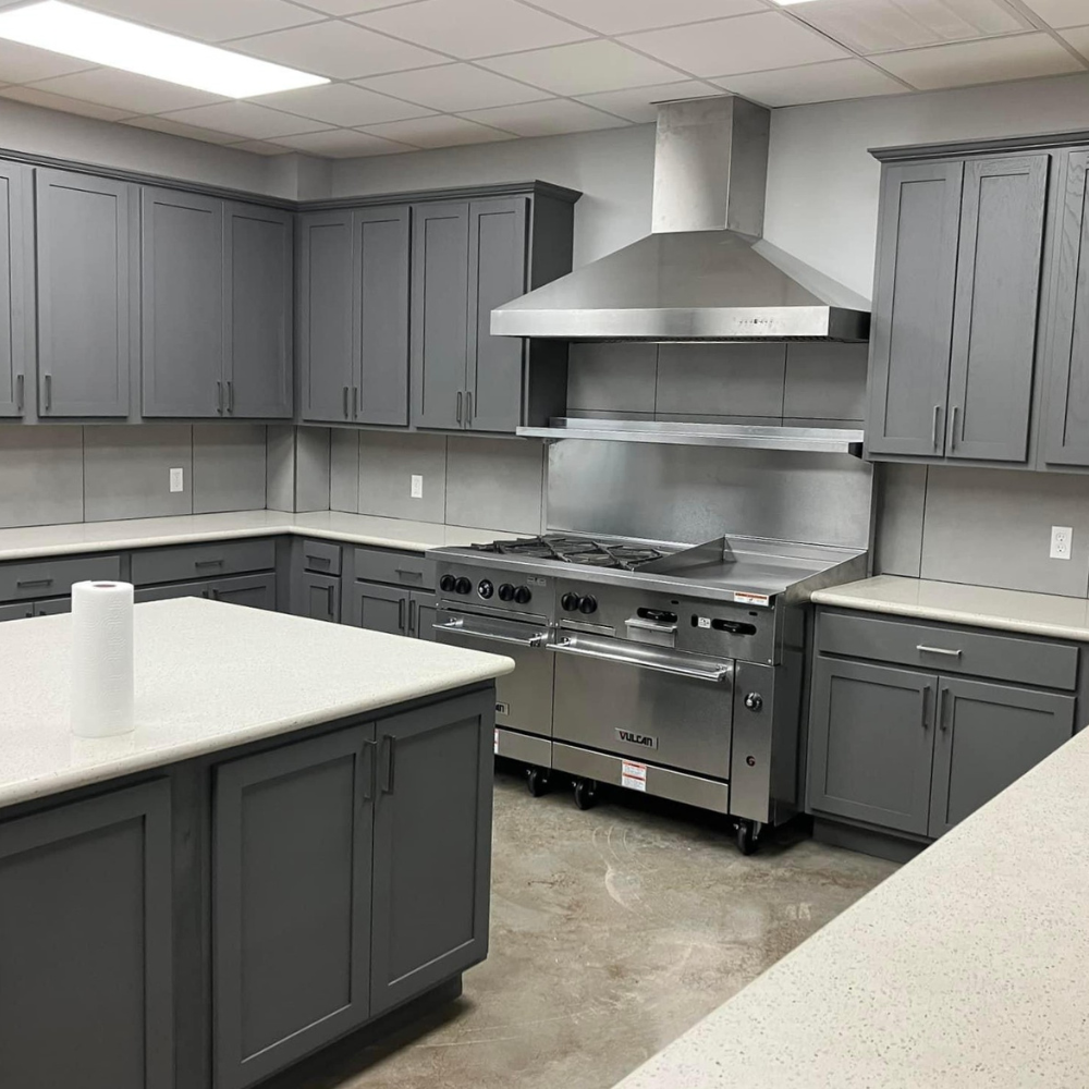 Grey wood cabinets in sleek, contemporary kitchen. 
